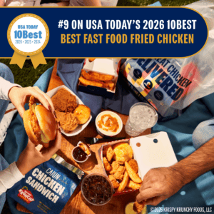 A picnic-style spread of Krispy Krunchy Chicken favorites, including fried chicken, tenders, fries, a chicken sandwich, biscuits, mac and cheese, and drinks, with a banner announcing Krispy Krunchy Chicken as the #9 Best Fast Food Fried Chicken in USA TODAY's 2026 10Best Readers' Choice Awards.